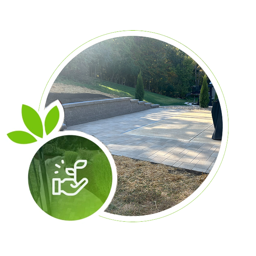 Stone patio with retaining wall and landscaped slope in Kirkwood.